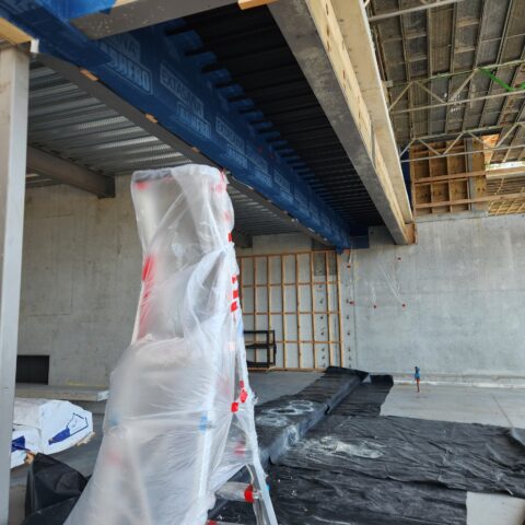 Soffit area prepared before closed-cell spray foam application