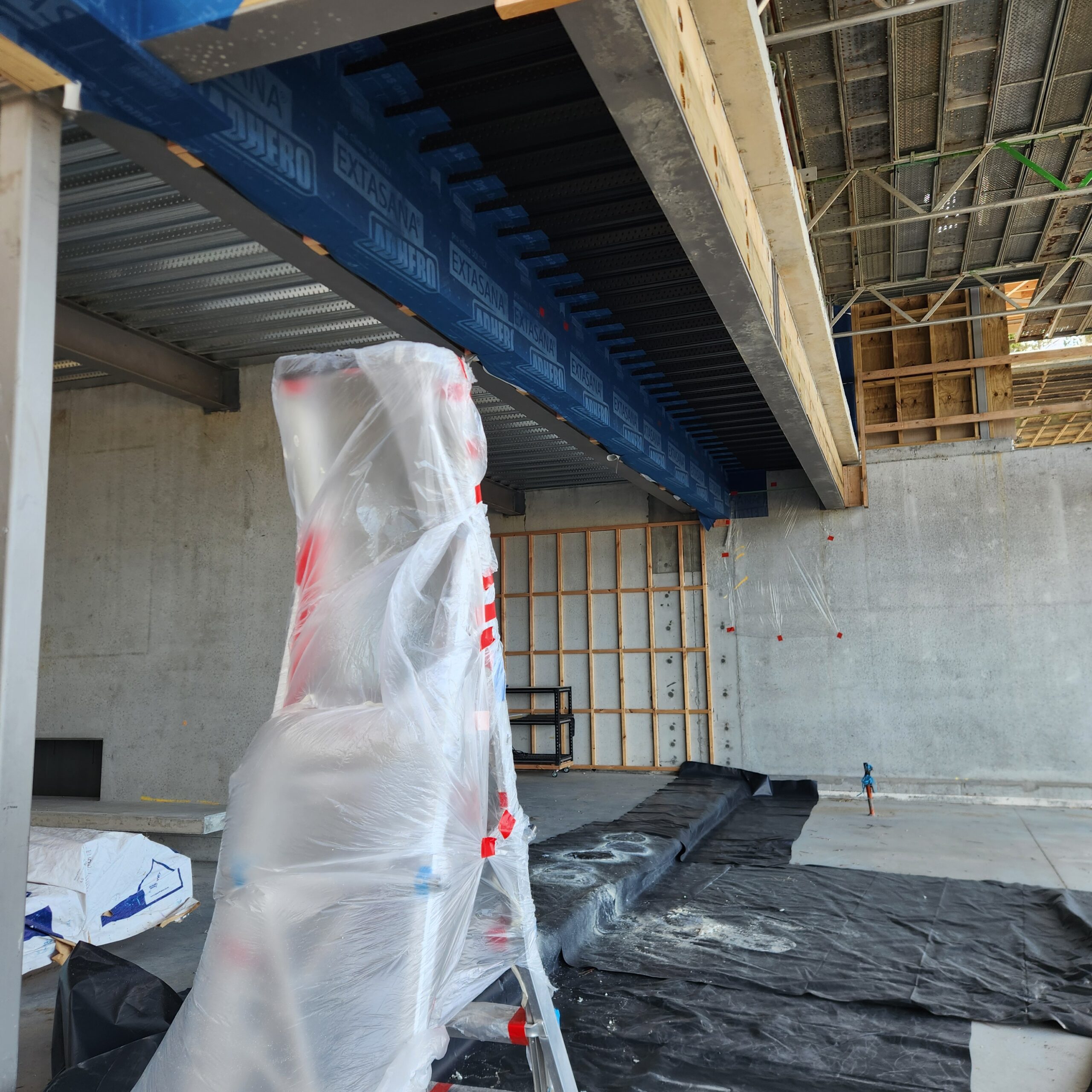 Soffit area at Te Arai Links prepped for spray foam insulation