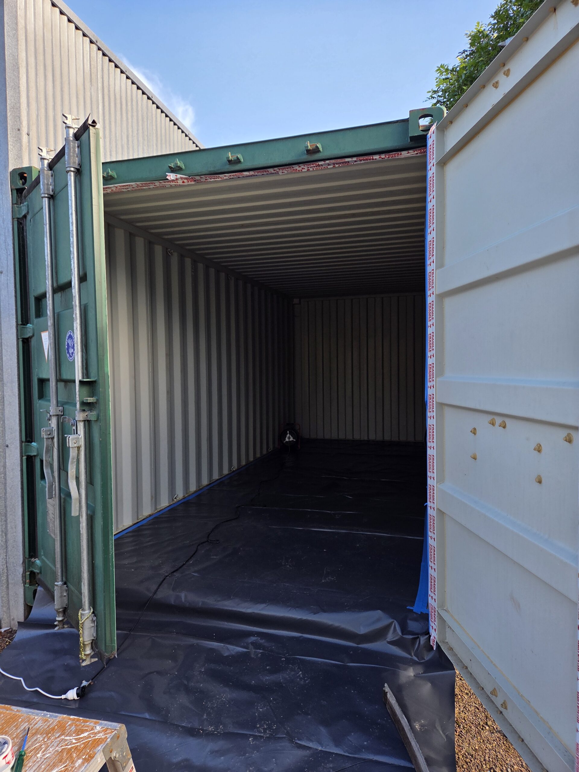 Shipping container prepped for spray foam insulation