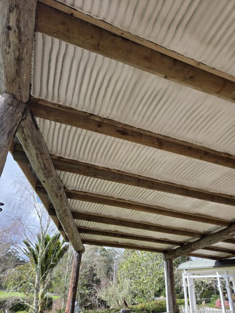 Close view of even spray foam coverage beneath the deck roof
