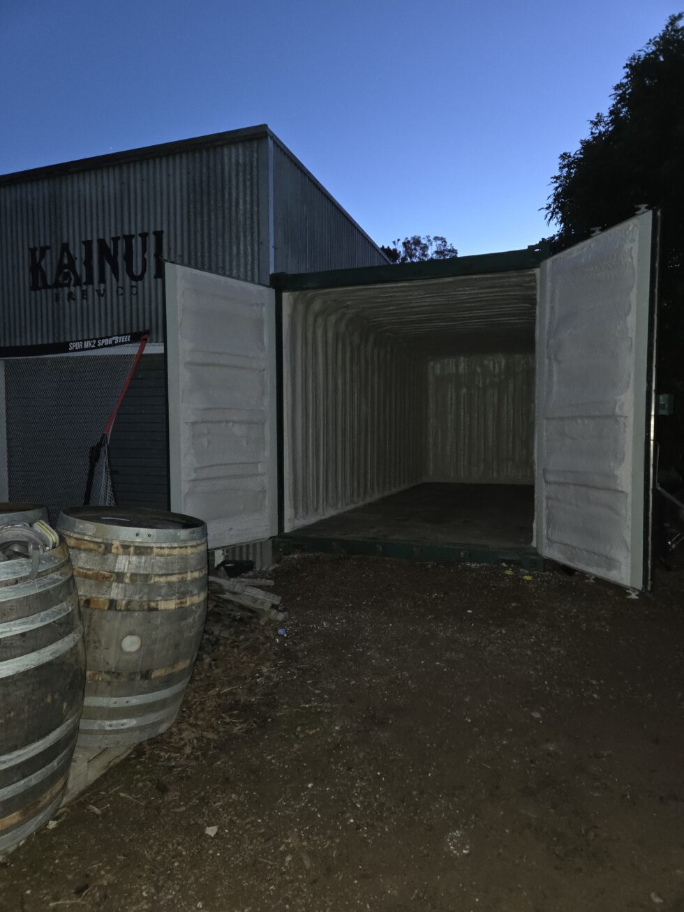 Wide view of a brewery storage container insulated with closed-cell spray foam