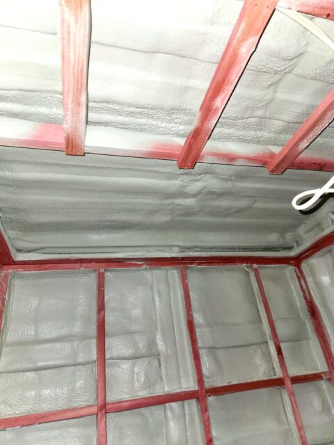 Closed-cell spray foam installed around the container ceiling framing