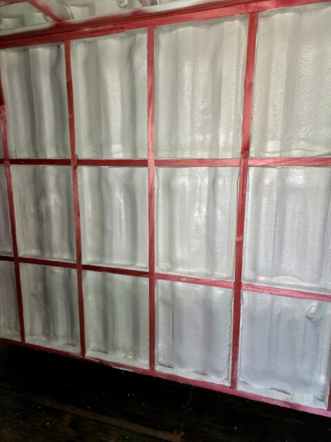 Closed-cell spray foam installed between container wall framing